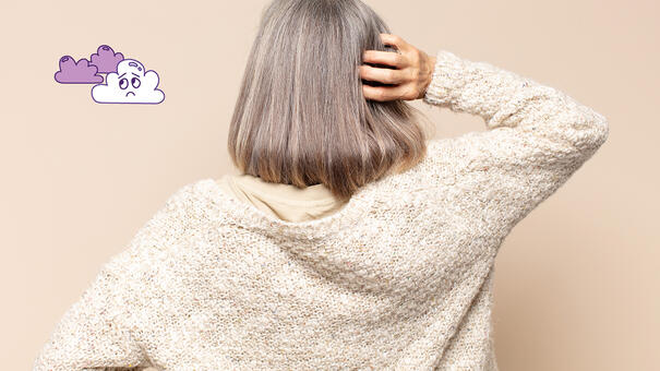 Personne de dos se grattant l'arrière de la tête