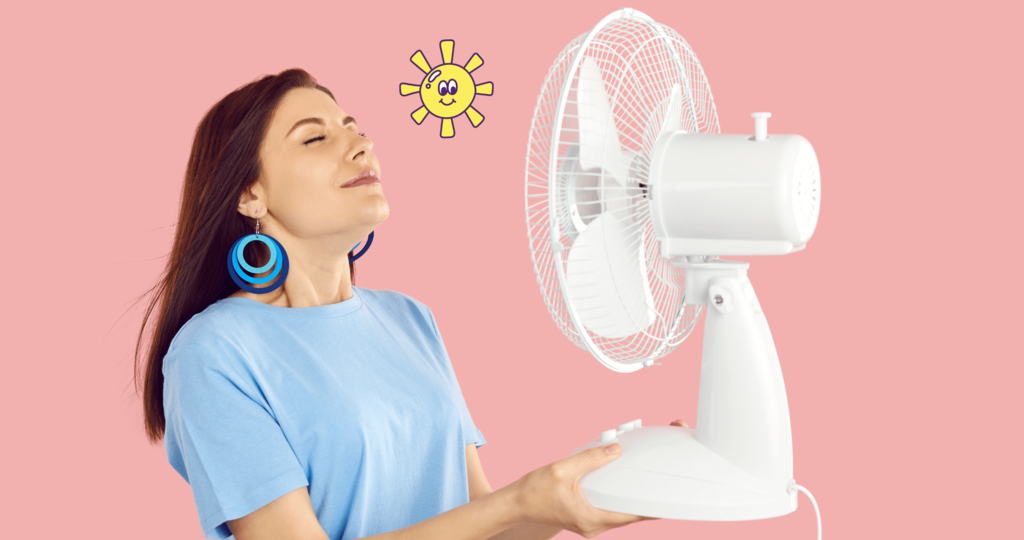 Femme avec un ventilateur